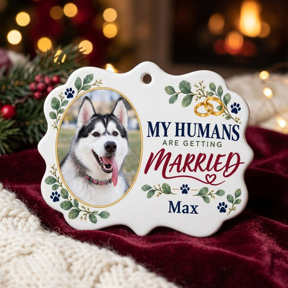 Scalloped medallion ornament with dog photo, eucalyptus, paw prints, and 'MY HUMANS ARE GETTING MARRIED' text.