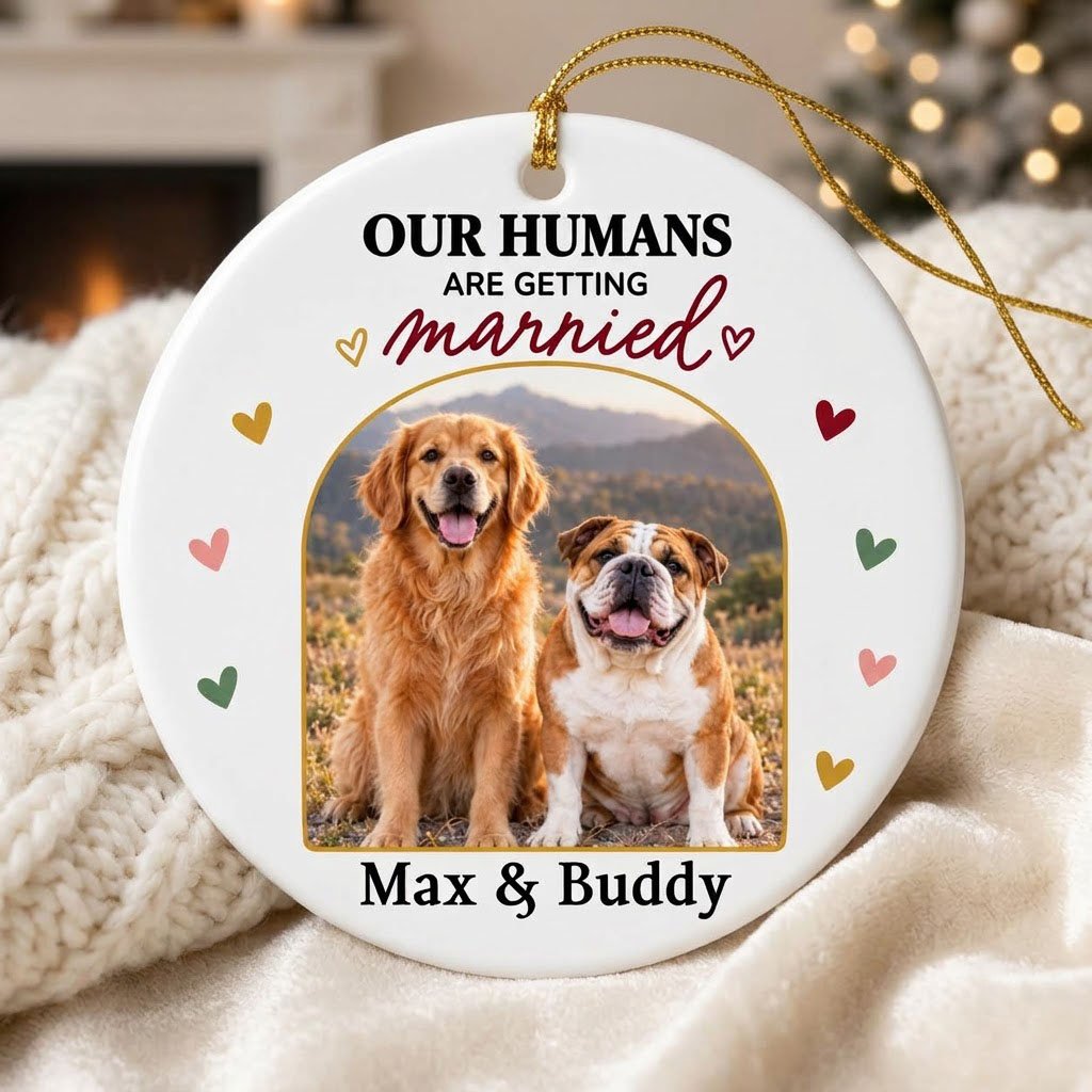 Round ceramic ornament with arch dog photo, “OUR HUMANS ARE GETTING married” text, and colorful heart accents.