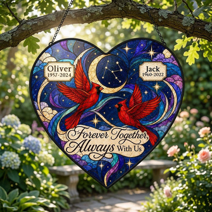 Heart stained glass suncatcher with two red cardinals, crescent moon, stars, clouds, and memorial name banners.