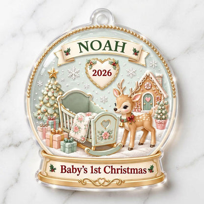 Acrylic snowglobe ornament with Baby's 1st Christmas, fawn with red bow, cradle, tree, gifts and gingerbread house