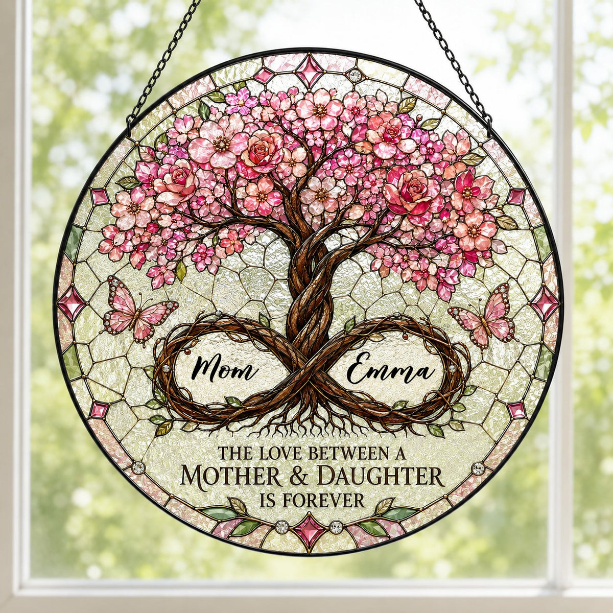 Round suncatcher with tree of life, pink blossoms, and 'THE LOVE BETWEEN A MOTHER & DAUGHTER IS FOREVER'