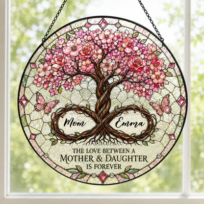 Round suncatcher with tree of life, pink blossoms, and 'THE LOVE BETWEEN A MOTHER & DAUGHTER IS FOREVER'