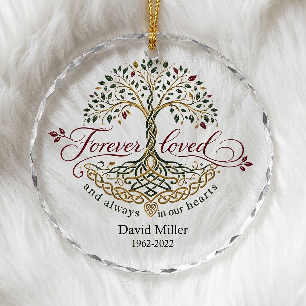 Round glass ornament with Celtic Tree of Life in green, gold and red, reading Forever loved and always in our hearts.