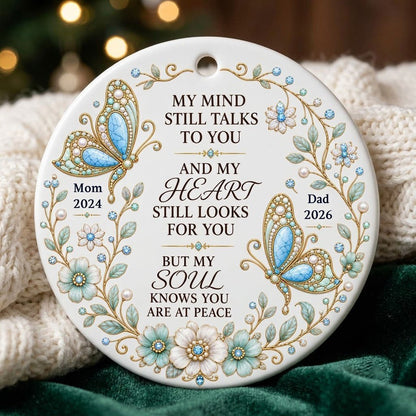 White round ornament with jeweled butterflies, floral wreath, and memorial quote with personalized name and year.