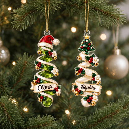 Acrylic ornament shaped around two green gem-style Christmas trees with holly, berries and names Oliver and Emma.