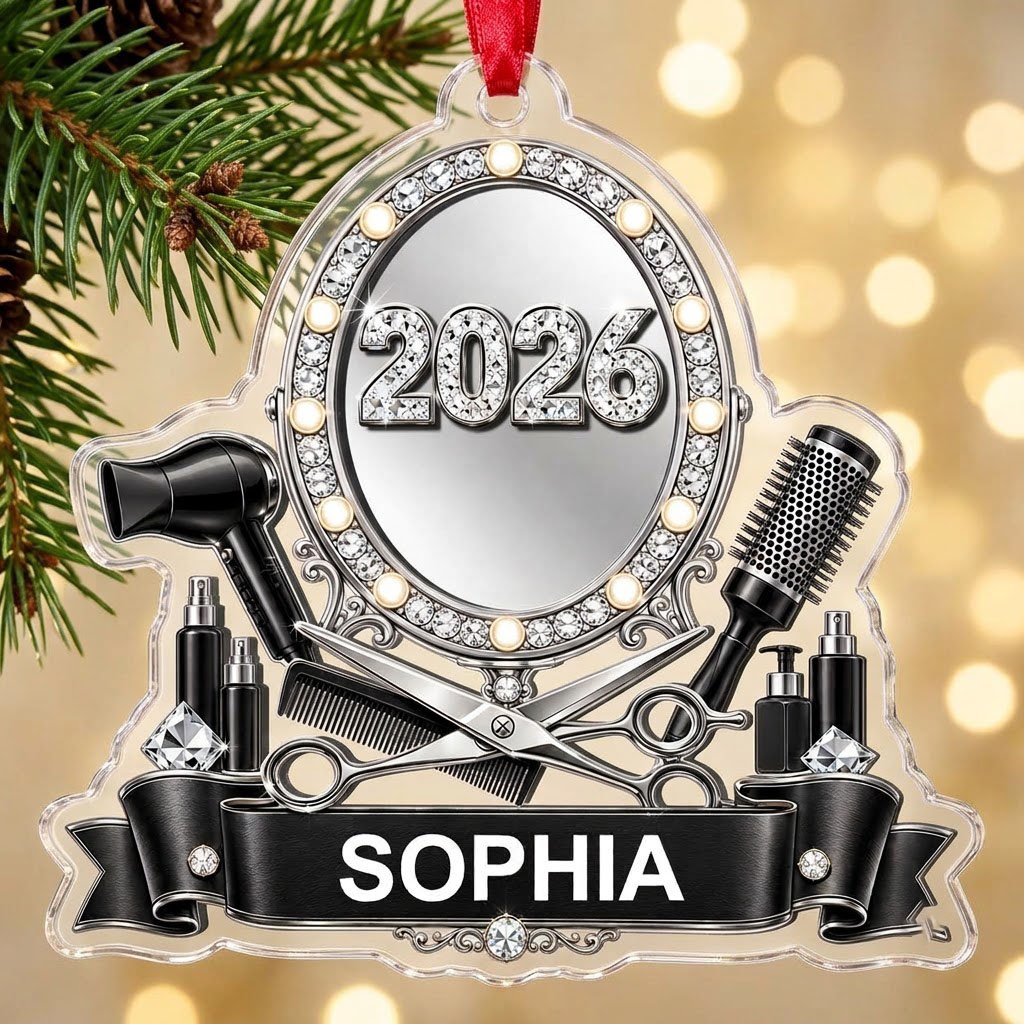 Clear acrylic ornament with a lit vanity mirror and salon tools, featuring SOPHIA and 2026 on a black banner.