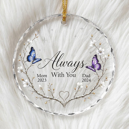 Round glass ornament with branch wreath, white blossoms, blue and purple butterflies, and Always With You text.