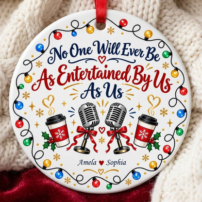 Round ceramic ornament with lights border, two microphones with red bows, and two coffee cups with heart steam.