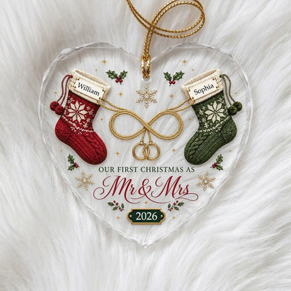 Heart glass ornament with red and green knit stockings, gold infinity loop with rings, Mr & Mrs text, names and date.