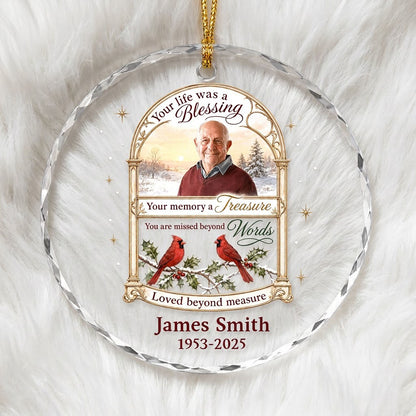 Round glass ornament with golden arched photo frame, two red cardinals on snowy pine and a memorial quote.