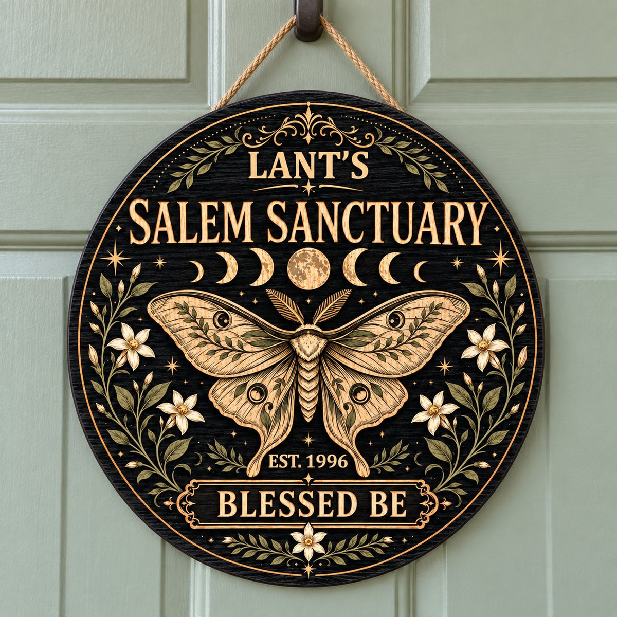 Round wooden sign with a central moth, moon phases, floral vines, stars, and 'Salem Sanctuary' 'Blessed Be' text.