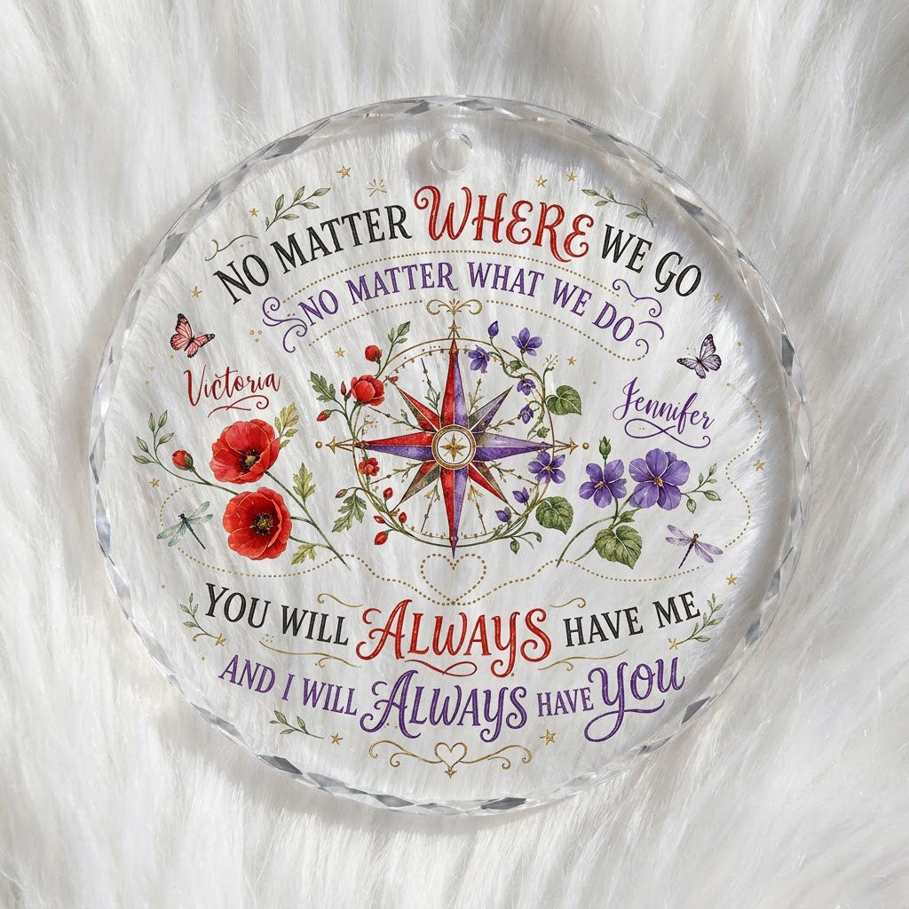 Round glass ornament with a compass rose, red and purple flowers, butterflies, dragonflies, and long-distance quotes.