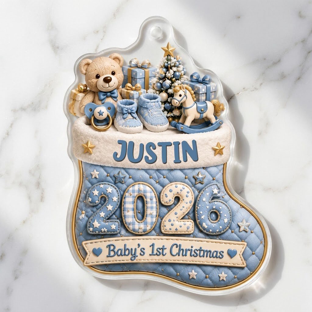 Blue quilted stocking ornament with teddy bear, baby toys, Baby's 1st Christmas text, and name and year.