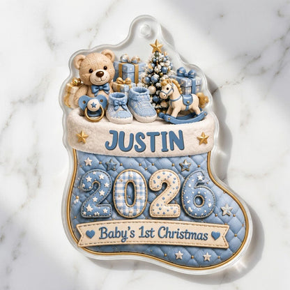 Blue quilted stocking ornament with teddy bear, baby toys, Baby's 1st Christmas text, and name and year.