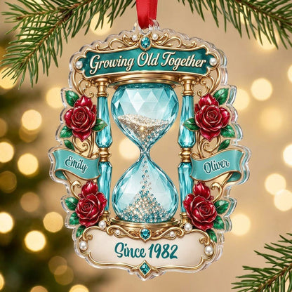 Custom-cut acrylic ornament with jeweled hourglass, red roses, and the words 'Growing Old Together'.