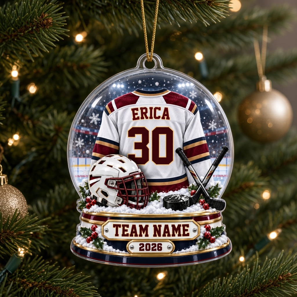 Acrylic snow globe ornament with hockey jersey, helmet, crossed sticks, puck, snowflakes and holly accents.