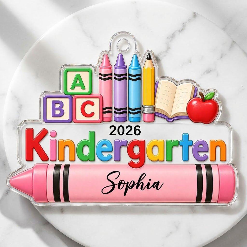 Clear acrylic ornament with ABC blocks, crayons, apple, open book and 'Kindergarten 2026' with a pink name banner