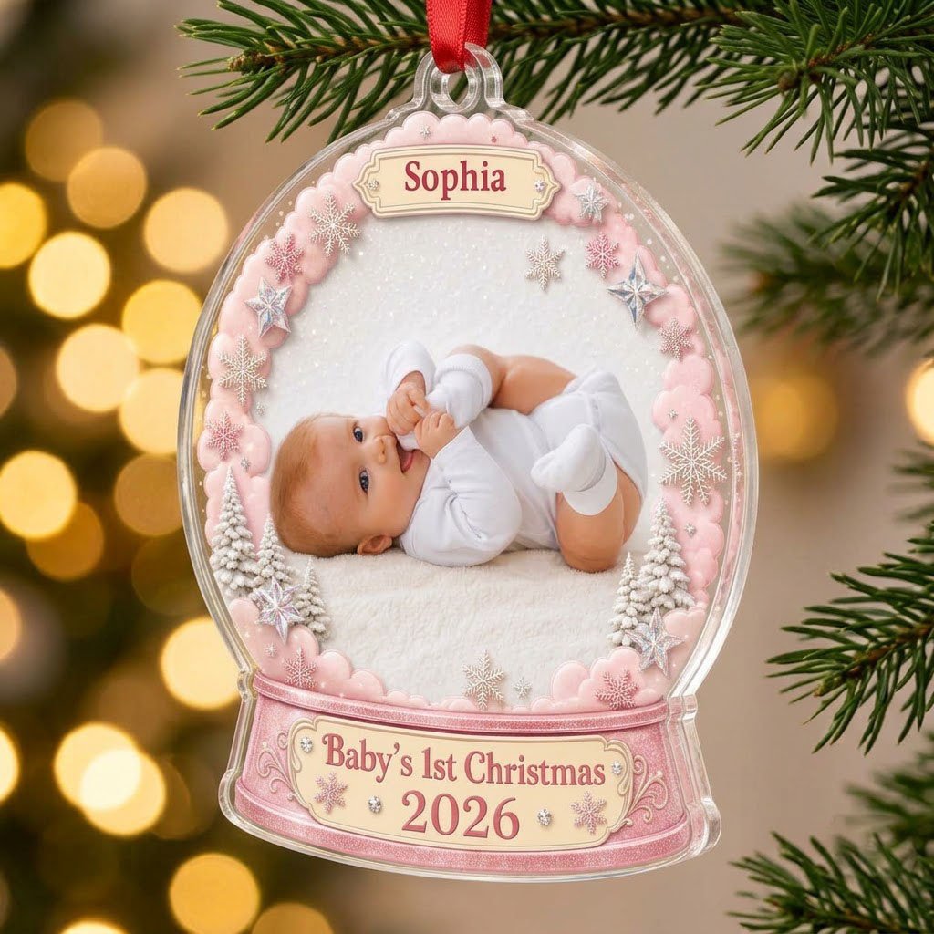 Pink snow globe acrylic ornament with "Baby's 1st Christmas", name banner, year base, and baby photo frame