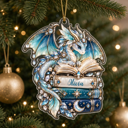 Custom-cut acrylic ornament of a jeweled blue dragon on stacked books with a red ribbon and a personalized name.