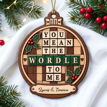 Bauble wood ornament with 'You Mean The Wordle To Me', green WORDLE tiles, holly and personalized names