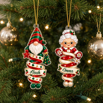 Clear acrylic ornaments shaped like a Christmas gnome and elf in red and green, each personalized with a name.