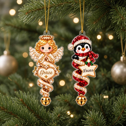 Acrylic angel and gingerbread ornaments with jeweled ribbons, heart or star name banners, and gold bells.