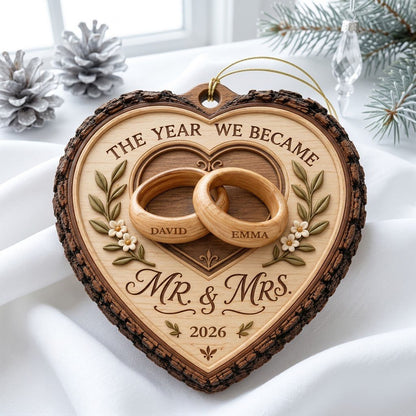 Heart-shaped wood ornament with bark edge, wedding rings, leafy vines, and 'THE YEAR WE BECAME MR. & MRS.' text.