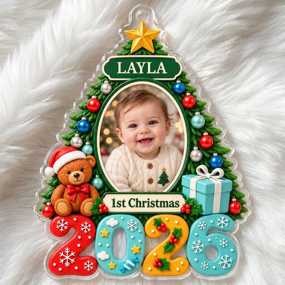 Green Christmas tree acrylic ornament with star topper, baby photo frame, teddy bear, and 2026 numbers.