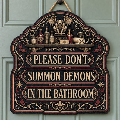 Ornate arched wooden sign with a gargoyle shelf and the message Please Don't Summon Demons in the Bathroom.