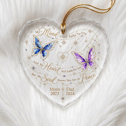 Heart-shaped glass ornament with blue and purple stained-glass butterflies, gold swirls, and memorial text.