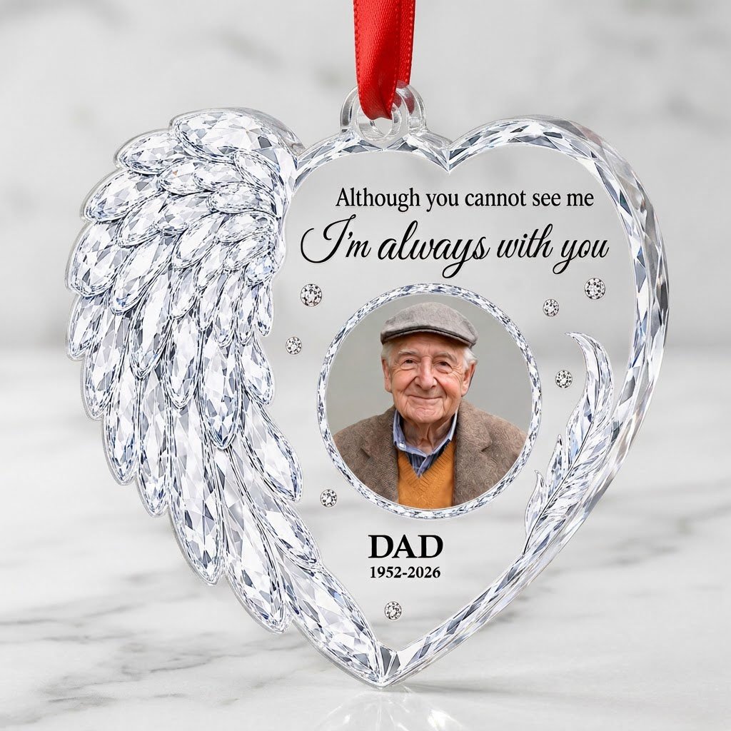 Clear acrylic heart ornament with crystal wing on the left, diamond accents, and a central circular photo frame.