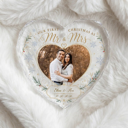 Heart-shaped glass ornament with couple photo, 'Our First Christmas As Mr & Mrs', pine sprigs, berries and gold snowflak