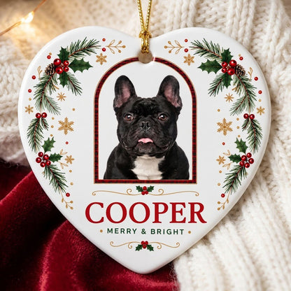 Heart ceramic ornament with dog photo in red-green plaid arch, holly, pine, gold snowflakes, and MERRY & BRIGHT text.