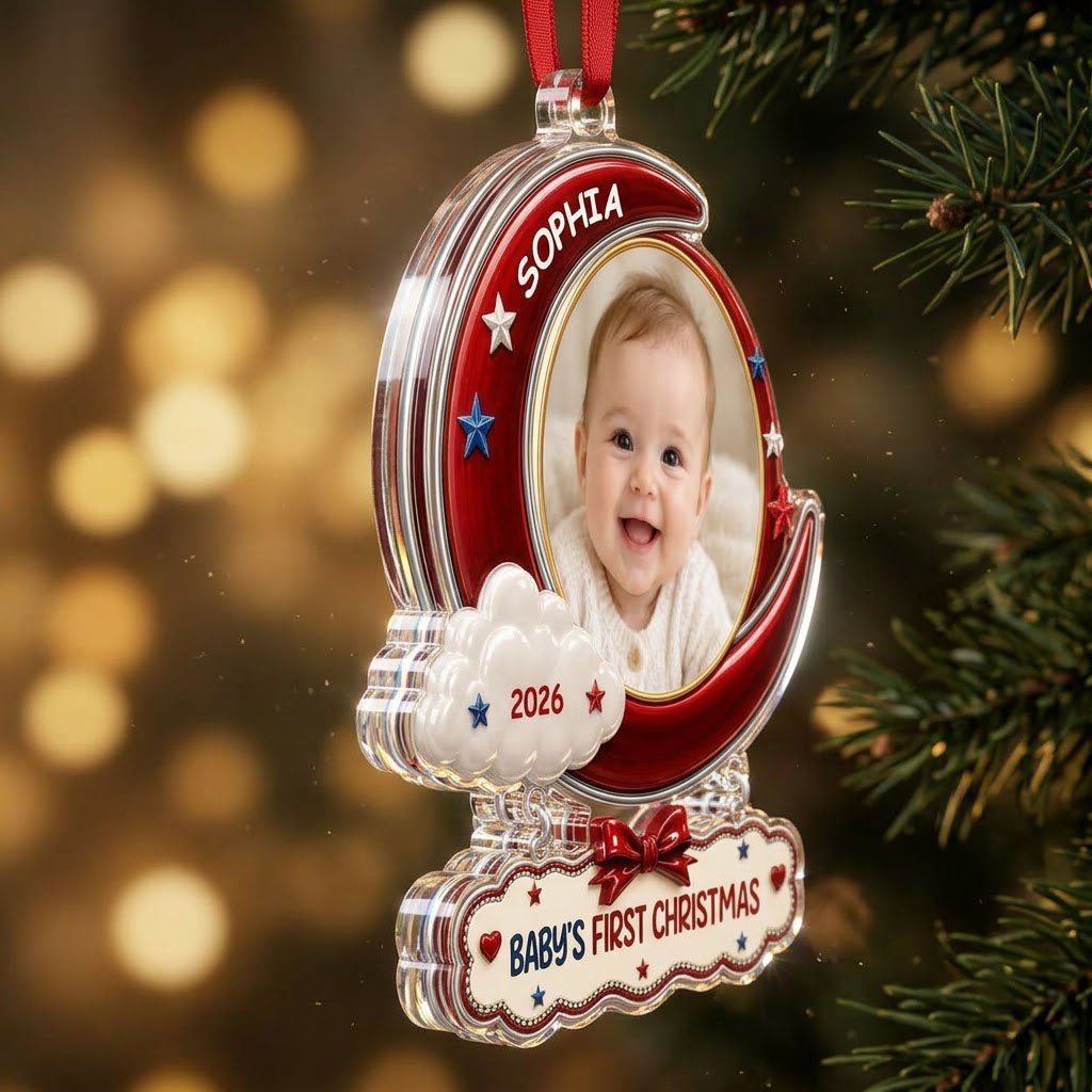 Red crescent moon acrylic ornament with baby photo, cloud, stars, and a plaque reading Baby's First Christmas.