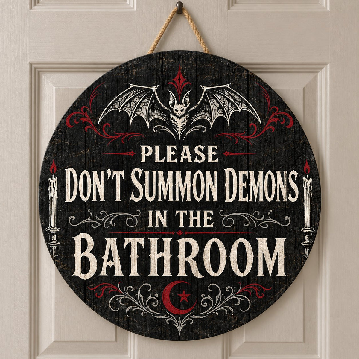 Round wooden sign with bat, filigree, candles and a crescent moon reading PLEASE DON'T SUMMON DEMONS IN THE BATHROOM.