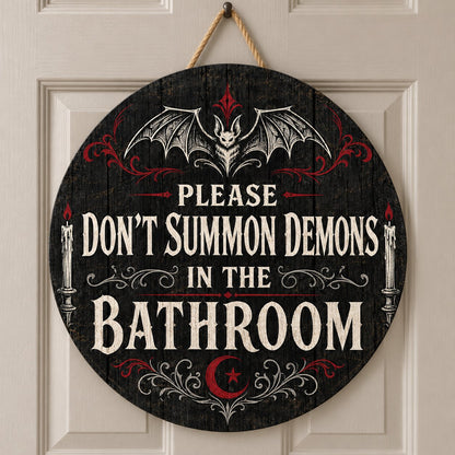 Round wooden sign with bat, filigree, candles and a crescent moon reading PLEASE DON'T SUMMON DEMONS IN THE BATHROOM.