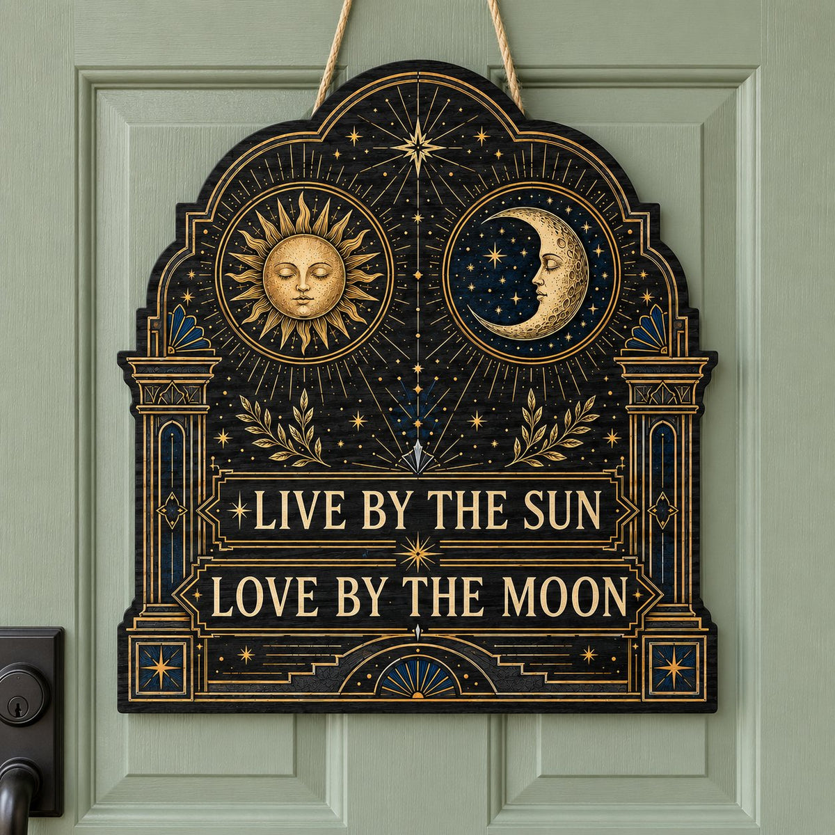 Arched wooden sign with sun and moon faces, constellations, and 'Live By The Sun, Love By The Moon'.
