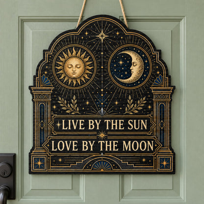Arched wooden sign with sun and moon faces, constellations, and 'Live By The Sun, Love By The Moon'.