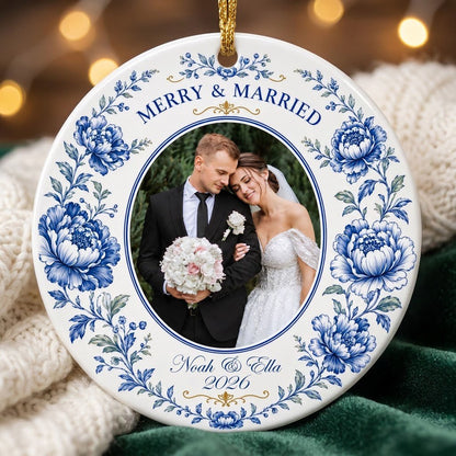 Round ceramic ornament with blue chinoiserie border, gold accents, and a circular wedding photo framed at center.