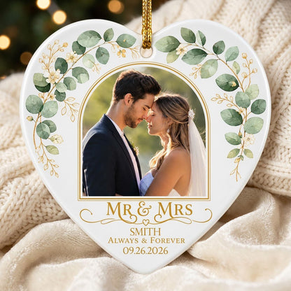 White heart ceramic ornament with wedding photo, eucalyptus leaves, gold accents, and text MR & MRS, ALWAYS & FOREVER.