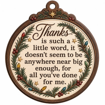 Wood ornament with arched top, pine branches, colorful lights, red berries, gold stars, and a heartfelt thank-you quote.