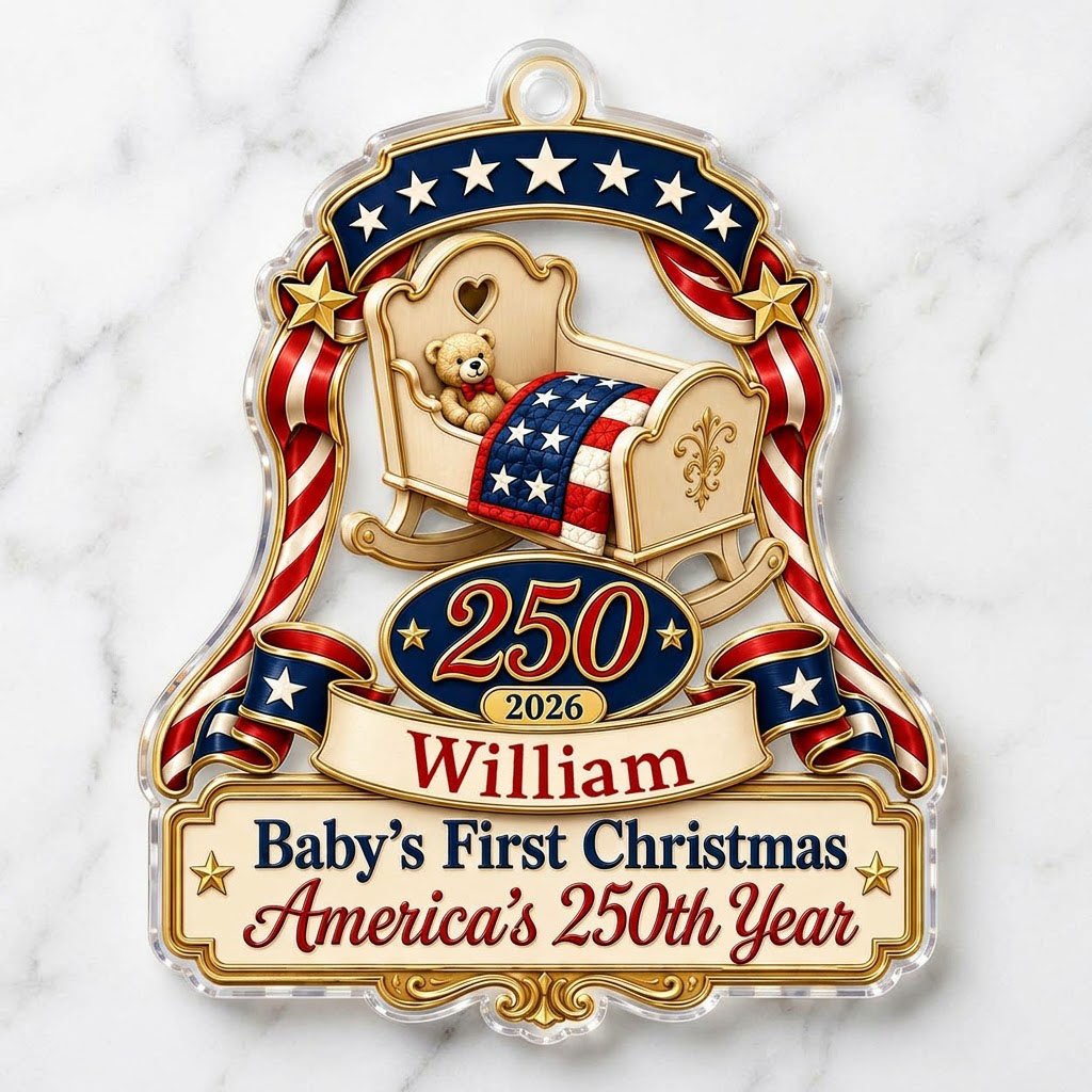 Acrylic ornament with baby crib, teddy bear, patriotic ribbon, and 'Baby's First Christmas', personalized with name and 