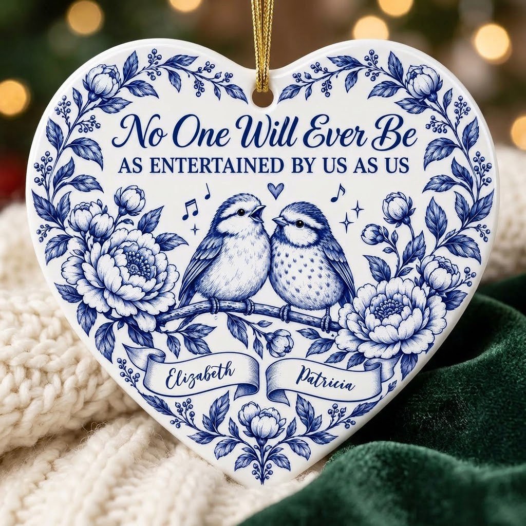 Heart ceramic ornament with two birds, blue floral frame, music notes above, and two name banners in cobalt.