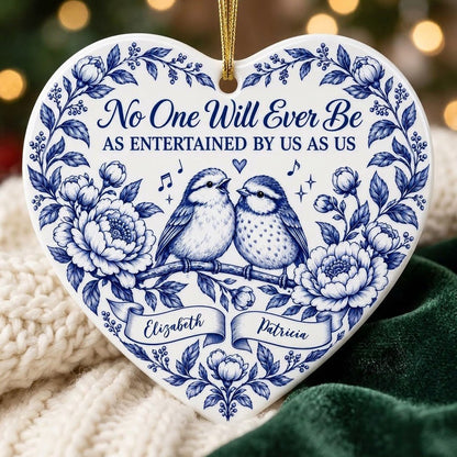 Heart ceramic ornament with two birds, blue floral frame, music notes above, and two name banners in cobalt.