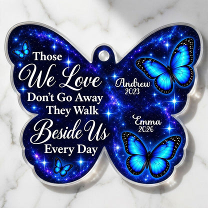 Butterfly-shaped ornament with blue butterflies and a galaxy background, reading Those We Love Don't Go Away.