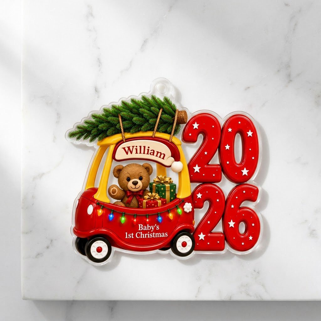Red toy car with pine tree, teddy bear and gifts, "Baby's 1st Christmas" and 2026 star-pattern numbers on clear acrylic.