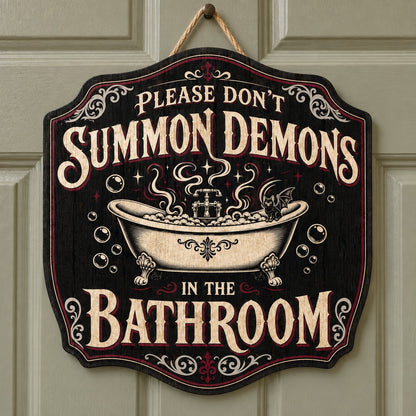 Ornate plaque with tub, bat-winged black cat, bubbles, stars, and 'Please Don't Summon Demons in the Bathroom'.