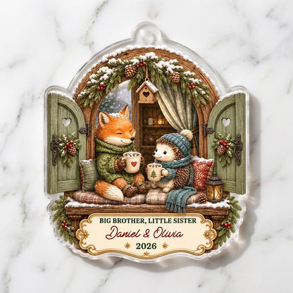 Arched window acrylic ornament with fox and hedgehog, garlands, birdhouse, and cream banner for names and year.