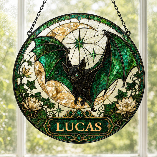 Round stained-glass style suncatcher with black bat, green wings, crescent moon, ivy, white flowers, and a personalized 