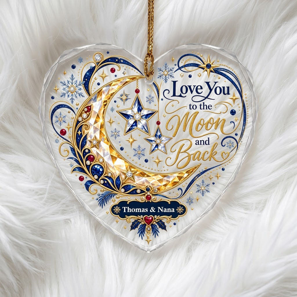 Heart glass ornament with jeweled gold crescent moon, blue hanging stars, and 'Love You to the Moon and Back' text.